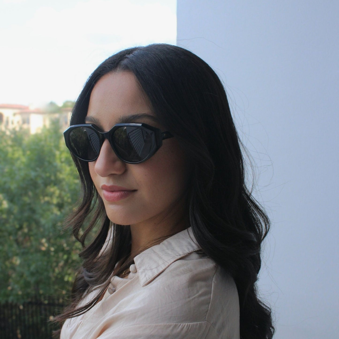 Geometric shaped sunglasses in classic black with a black lens