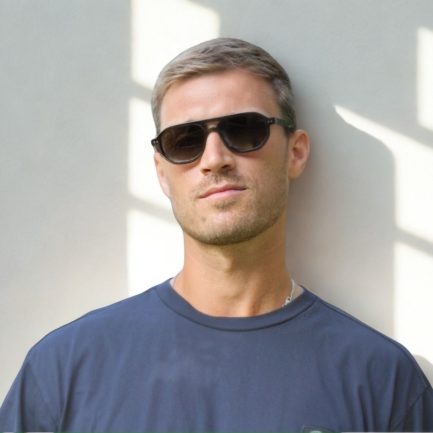 Smaller geometric frame in classic black with a black/grey lens