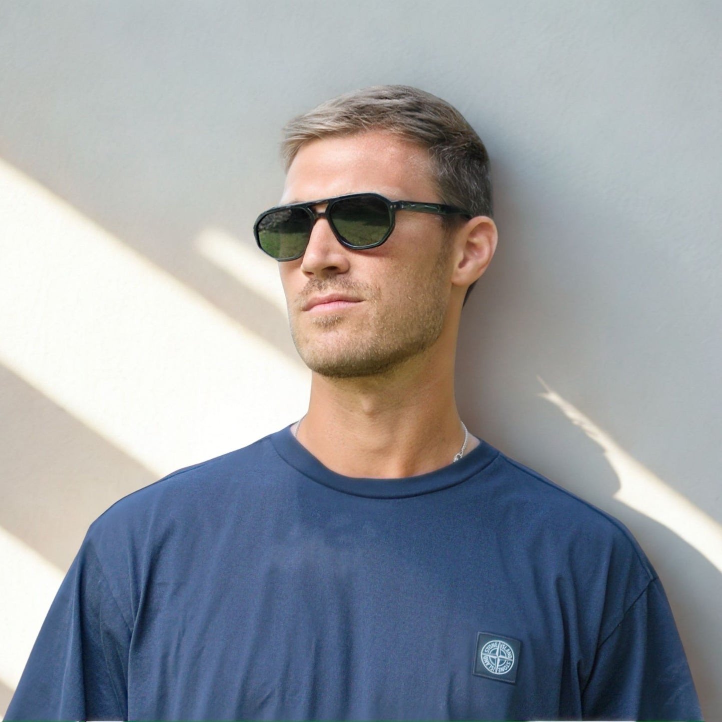 Smaller geometric frame in classic black with a black/grey lens