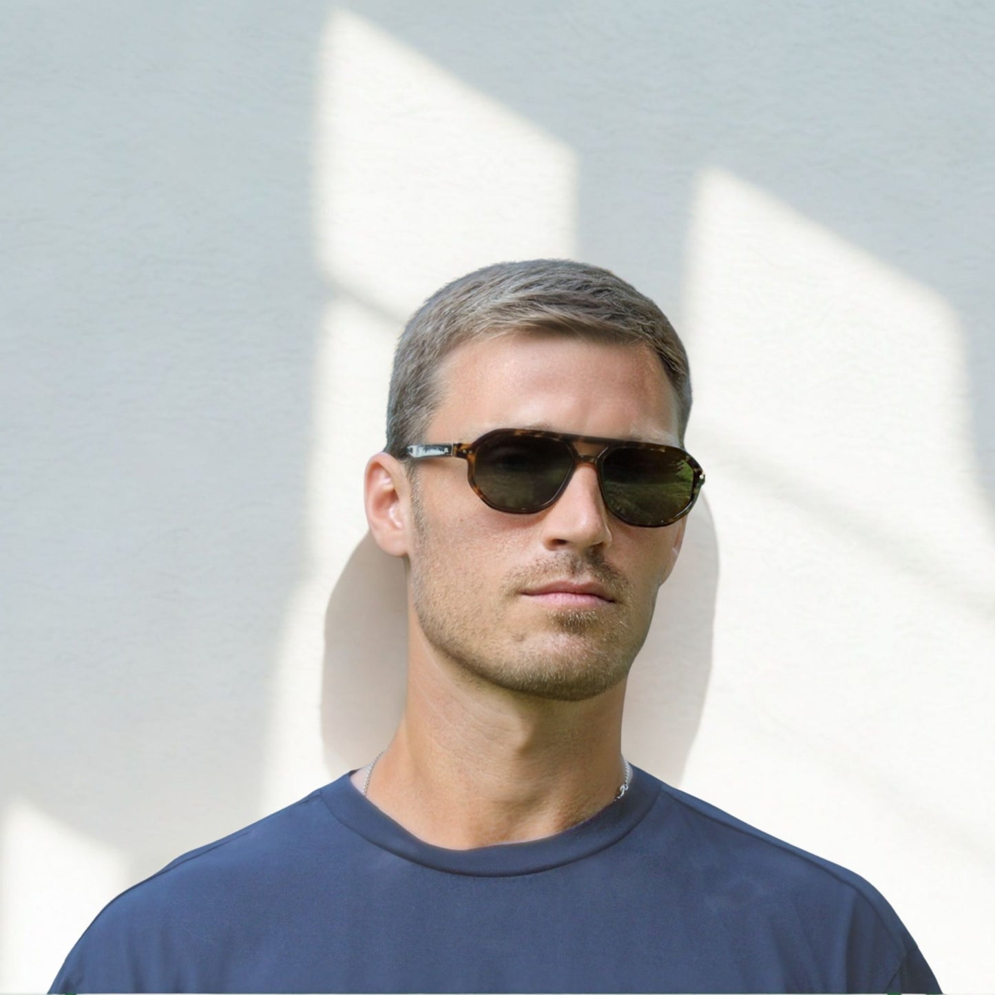 Smaller geometric frame in tortoise with a black/grey lens